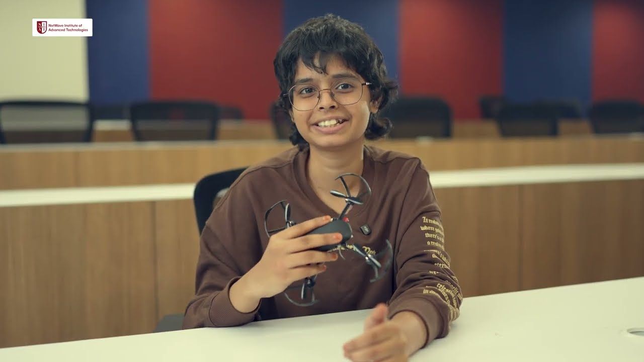 A student holding a drone