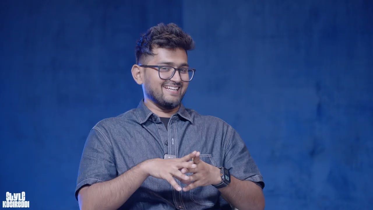 Tharun Speaks talking against a blue backdrop