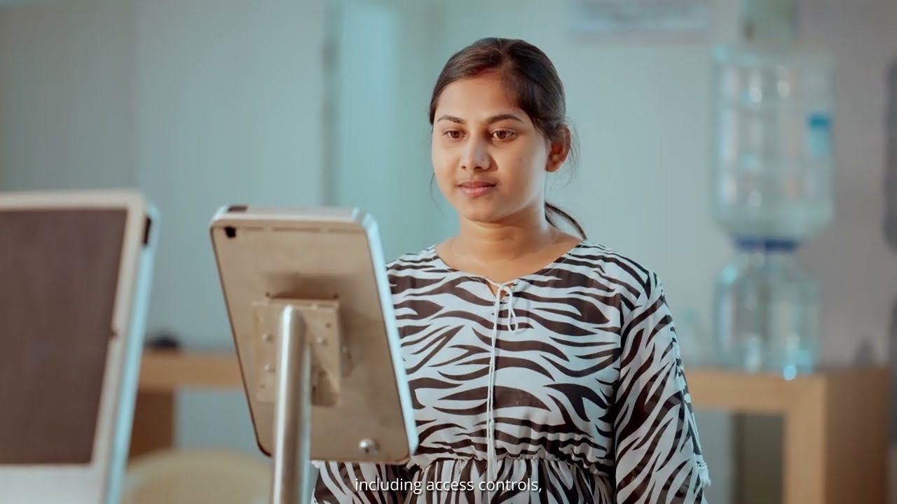 A woman using a tablet kiosk