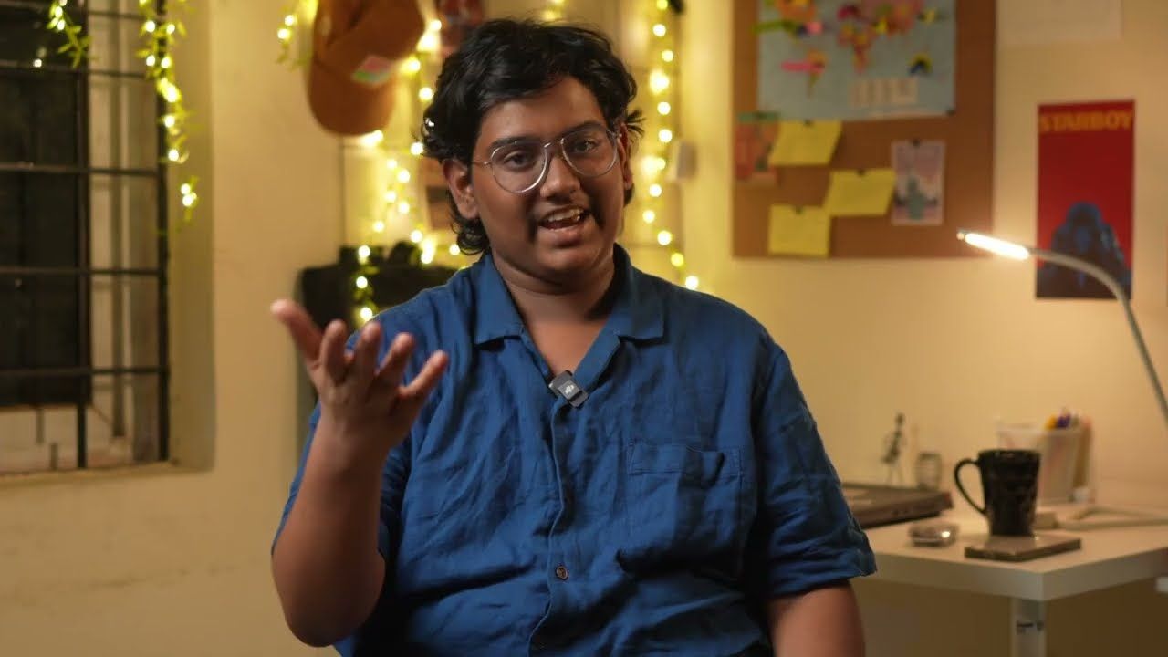 A creator talking in a warmly lit room